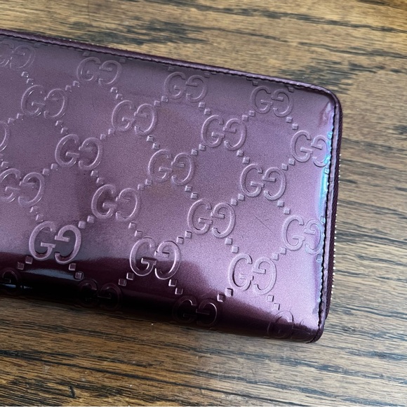 ***NOT FOR SALE!!
Gucci Metallic Purple GG Patent Leather Heart Zippy Wallet - Picture 2 of 16
